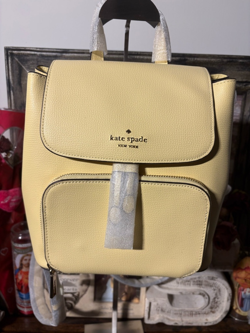 kate spade pale yellow pebble leather backpack